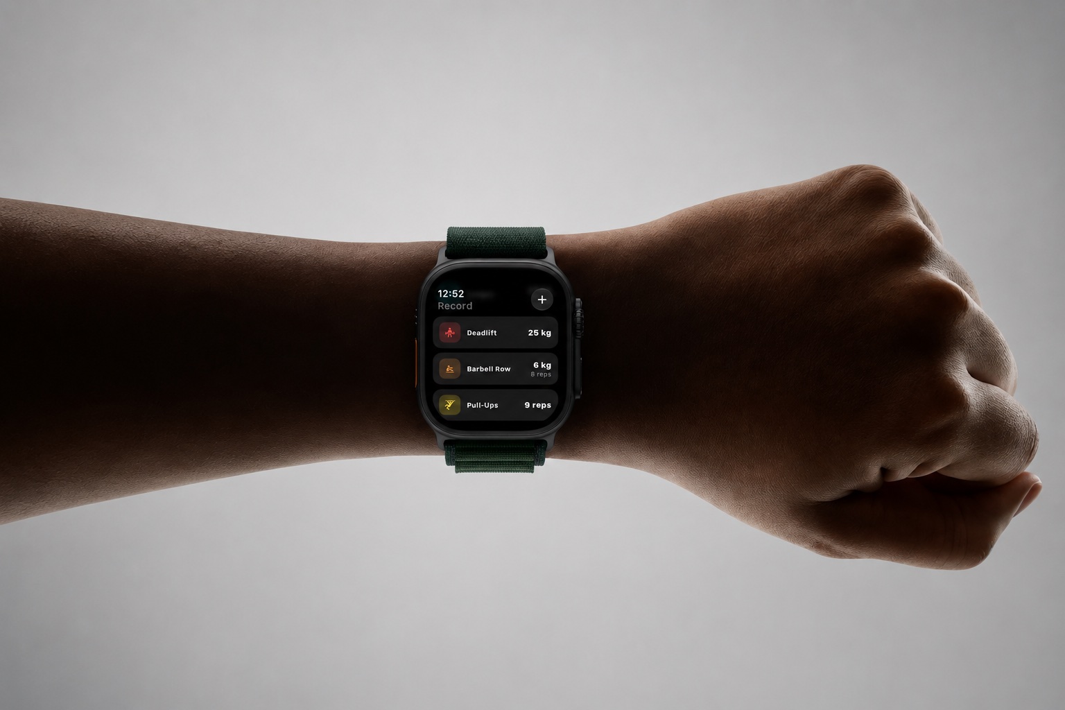 Record+ workout list shown on Apple Watch worn on a wrist